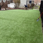 Backyard artificial turf installation in progress at a Cleveland, Ohio property