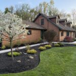 Spring black mulch bed installation and flowering tree at a Cleveland, Ohio commercial property