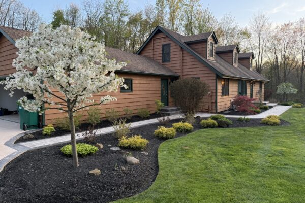 Spring black mulch bed installation and flowering tree at a Cleveland, Ohio commercial property