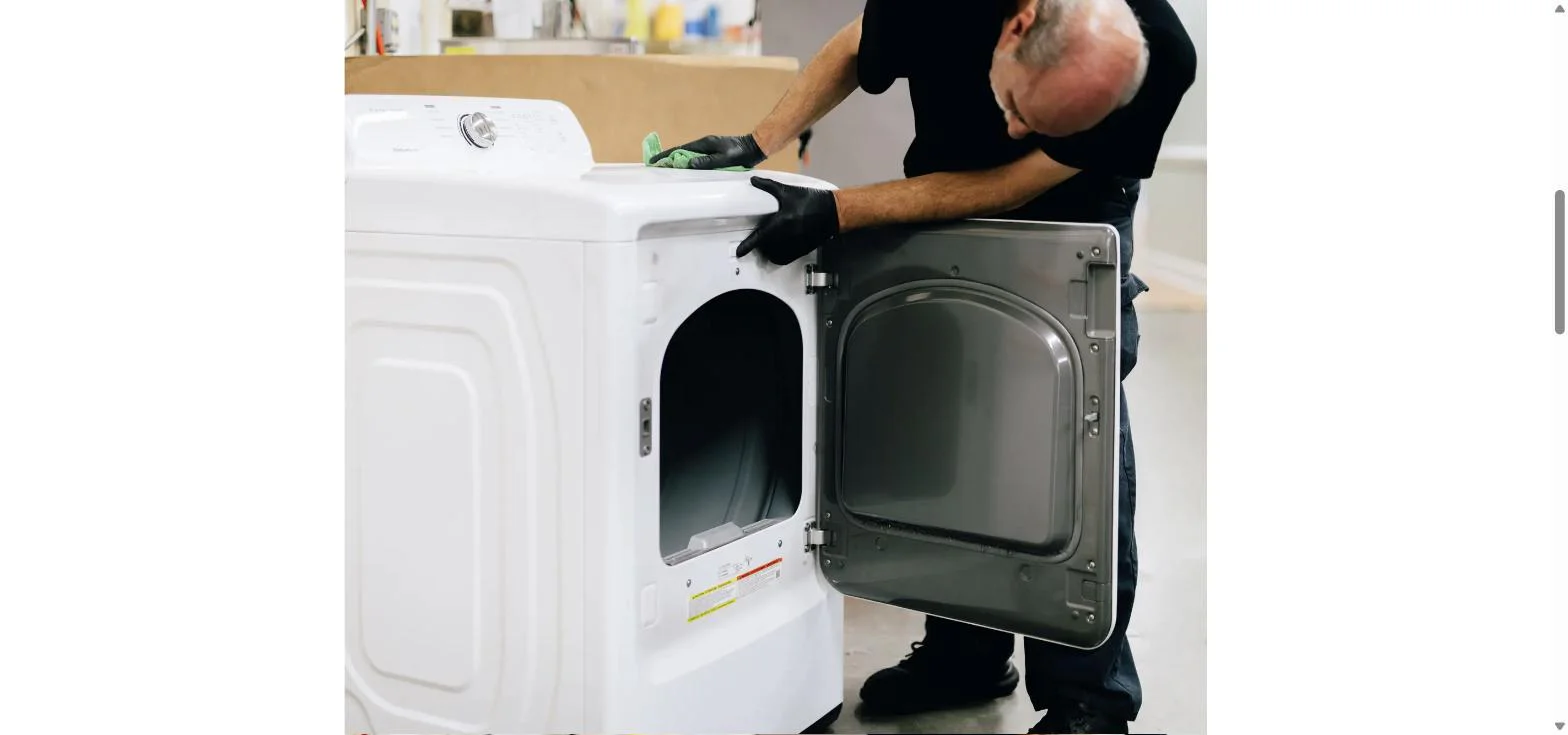 Restoration technician cleaning a recovered appliance